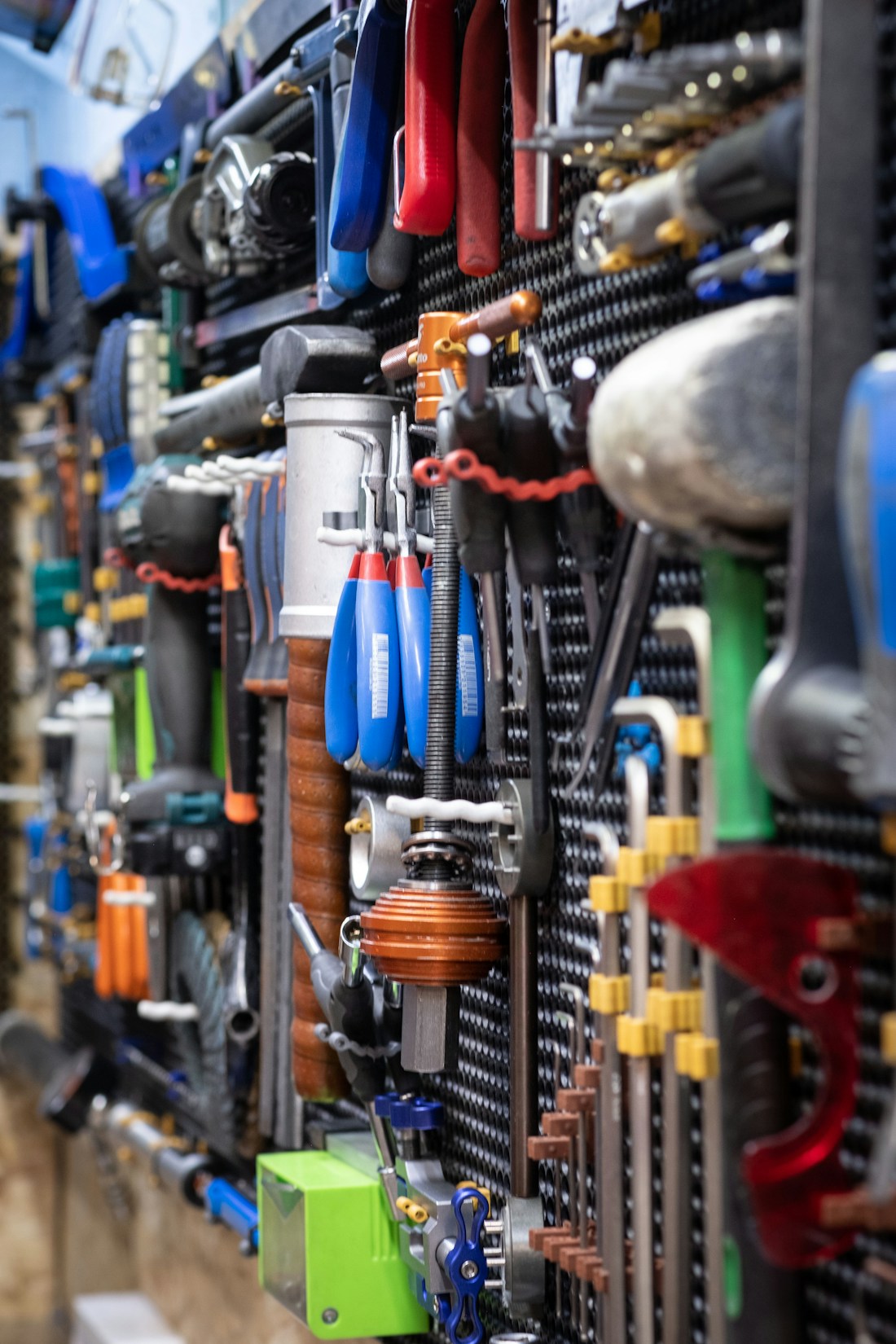 Hand tools arranged on a workshop wall